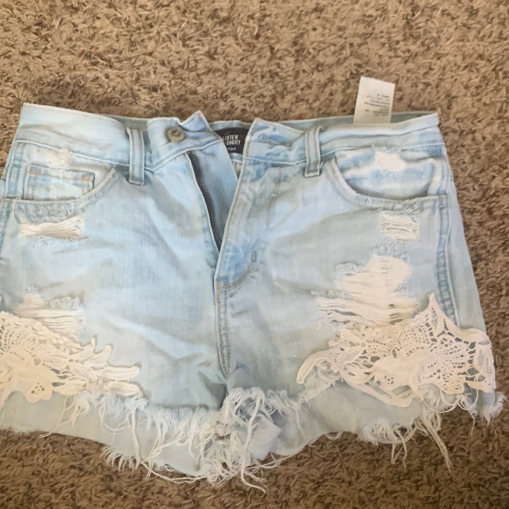 light washed denim super cute detailed bottom. short shorts